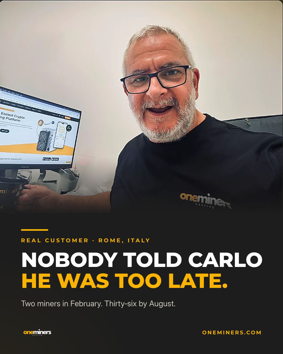 Carlo Paolantoni beside a computer, wearing a OneMiners shirt.